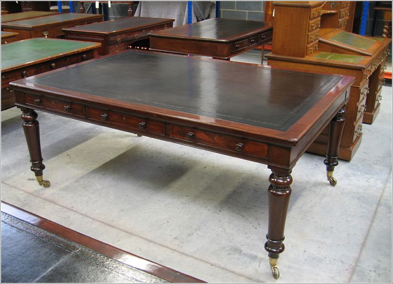 3009 View of Holland and Sons Table in Antiquedesks.net warehouse (1)